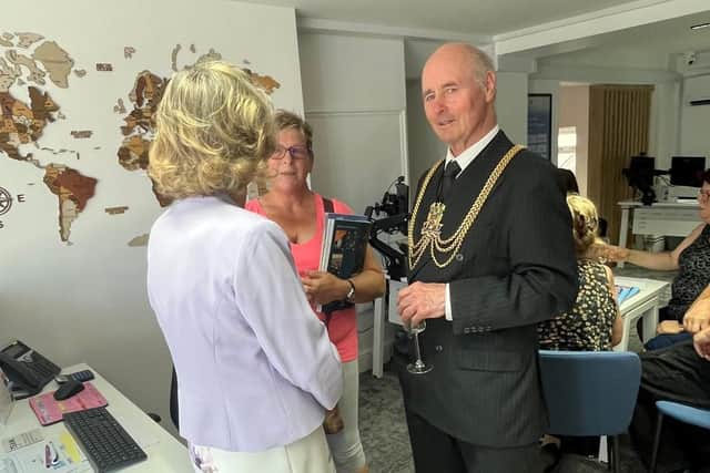 Mayor of Boston Coun Jonathan Noble inside the branch after performing the ribbon-cutting honours.