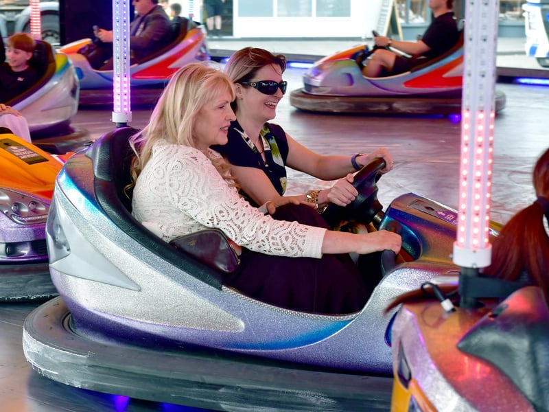 Councillors Susanne Weberry and Sarah Sharpe on the dodgems.