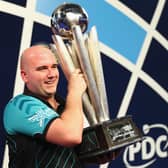 Rob Cross won £400,000 after winning the 2018 PDC World Darts Championships to complete a stunning transformation from 12 months ago. (Photo by Naomi Baker/Getty Images)