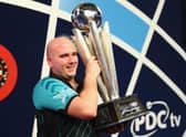 Rob Cross won £400,000 after winning the 2018 PDC World Darts Championships to complete a stunning transformation from 12 months ago. (Photo by Naomi Baker/Getty Images)