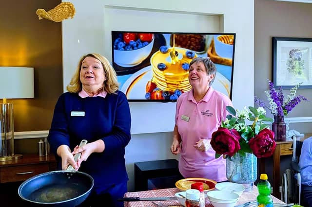 The homes activities team Claire (left) and Maria (right) hosting the pancake fun