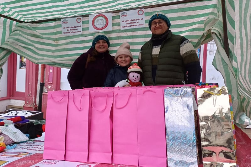 Heather Appleyard, Poppy Sykes and Ben Sykes on the Friends of Nettleton Community Primary School stall