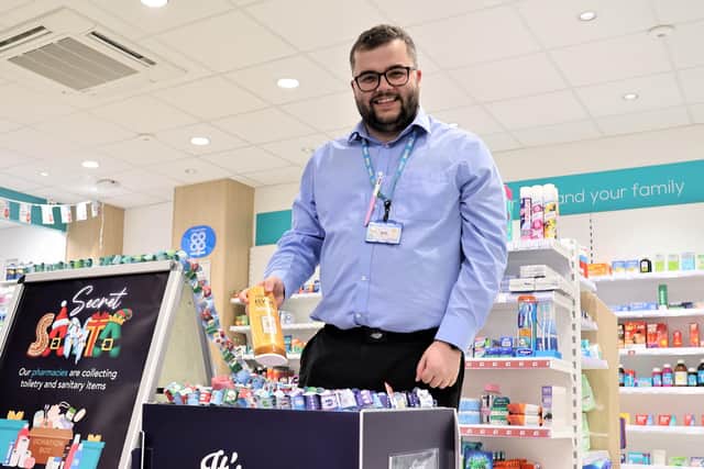 Lincolnshire Co-op Pharmacist with Secret Santa donation bin