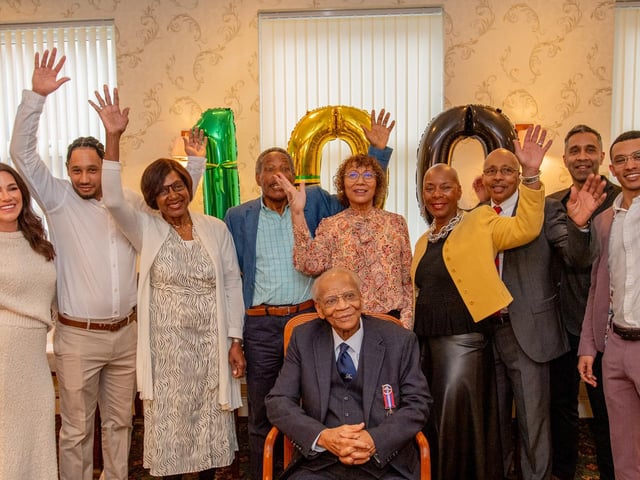Members of Ralph's family, helping him mark his 100th birthday.