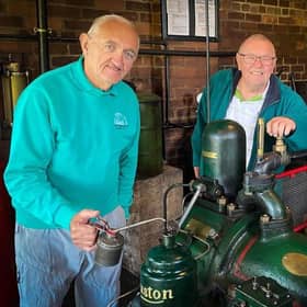 Volunteers Dave Hall and Alan Martin oiling the Ruston 7XHR diesel engine that will be at work at Sunday's event (PHOTO BY: Chris Frear)