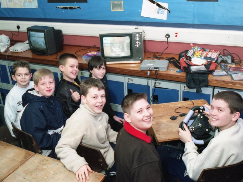 Marathon gaming in 2001. For anyone interested, the game being played on the TV in the centre of the photo appears to be Driver 2. We had less to go on for the other game, just the presence of a Sega Dreamcast and the sight of some blurry skyscrapers; however, a Dreamcast owner from back in the day has impressively identified it for us as Sonic Adventure, specifically part of the intro (https://www.youtube.com/watch?v=_efv7ZGAdjo).