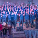 The new Men United In Song choir join members of Louth Male Voice Choir for a rousing number at the concert at Louth Town Hall.