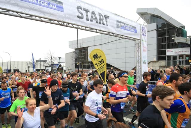 Half marathon runners on Arundel Gate in Sheffield. Picture: Chris Etchells.