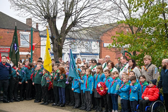 Members of the Kirton community pay their respects at the war memorial.