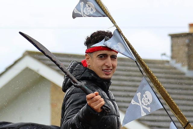 Smile or face the pirates in the carnival procession.