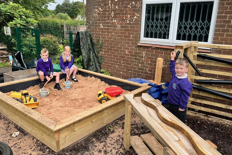 Pictured in the new snad play area, from left: Chase Trapmore, 5, Evadine Pascoe, 5, and Arlo Boughtwood, 5.