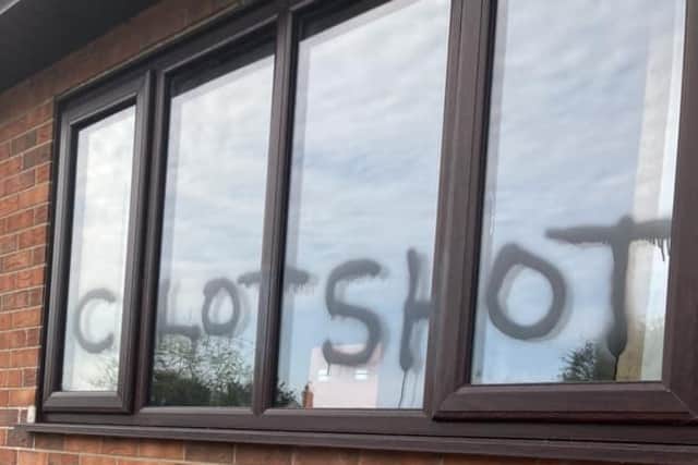 The anti-vax graffiti was sprayed over the windows at Trusthorpe village hall.