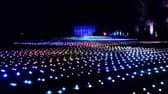 Sea Of Light - the dazzling Coldplay light show washes across the landscape in shimmering waves next to Belton House