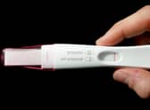 A home pregnancy test, and its instructions.
