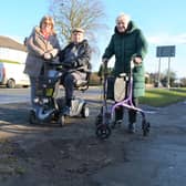 Brian and Norma Sales, with daughter Pauline Blaker, at one of the broken up areas of footpath