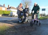 Brian and Norma Sales, with daughter Pauline Blaker, at one of the broken up areas of footpath