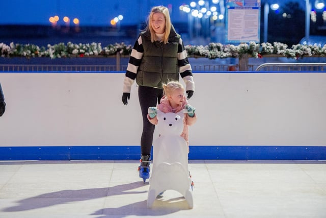 Hold on tight - families have been enjoying ice skating on the pier.