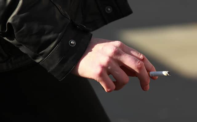 A woman smoking in central London.
