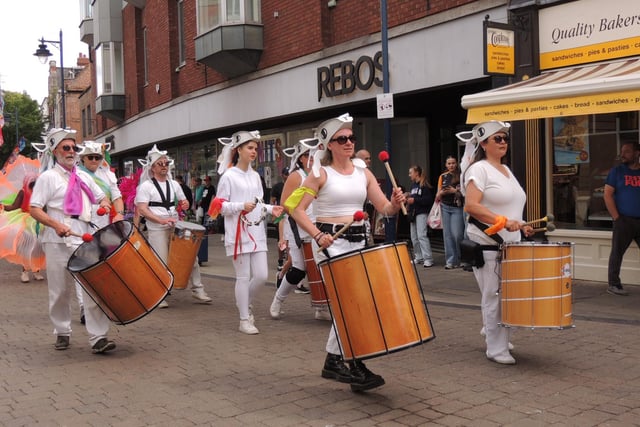 The Derwent Valley Drummers providing live drumming. The folkloric headdresses were created in the run-up to the event in workshops led by artist Ruth Pigott.