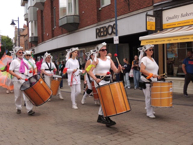 The Derwent Valley Drummers providing live drumming. The folkloric headdresses were created in the run-up to the event in workshops led by artist Ruth Pigott.
