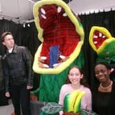 The cast and Audrey II.