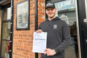 Elliot Reynolds, 21, who lives in Louth, with the certificate that shows he has achieved a major milestone as a brewer. (PHOTO BY: Docks Beers)