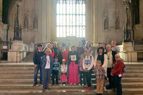 Victoria Atkins MP with representatives from the Louth Area of Sanctuary and a group of Ukrainian refugees in Parliament.