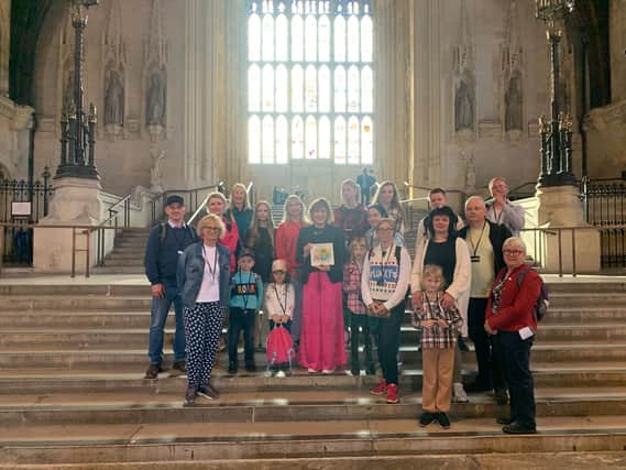 Victoria Atkins MP with representatives from the Louth Area of Sanctuary and a group of Ukrainian refugees in Parliament.