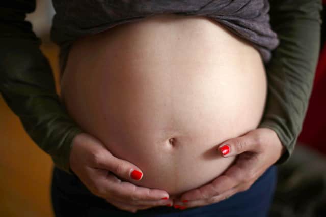 File photo dated 24/05/18 of a pregnant woman. Companies are being urged to sign up to a new pledge to support employees affected by miscarriage. The Miscarriage Association wants businesses and organisations to agree to meet its new pregnancy loss standard to ensure staff get the support and time off they need. Issue date: Monday September 6, 2021.
