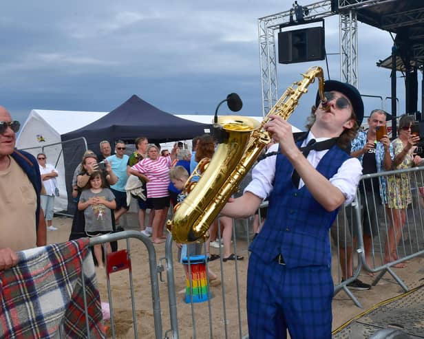 Complete Madness tribute act performs for the crowds on Mablethorpe beach. Photo: David Dawson