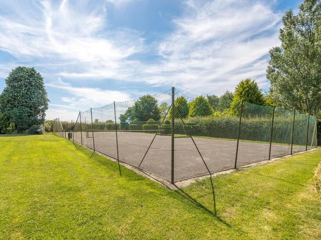 The tennis court.