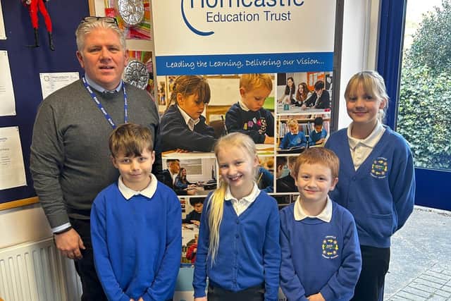 Executive headteacher Damian Davey with children from Frithville Primary School.
