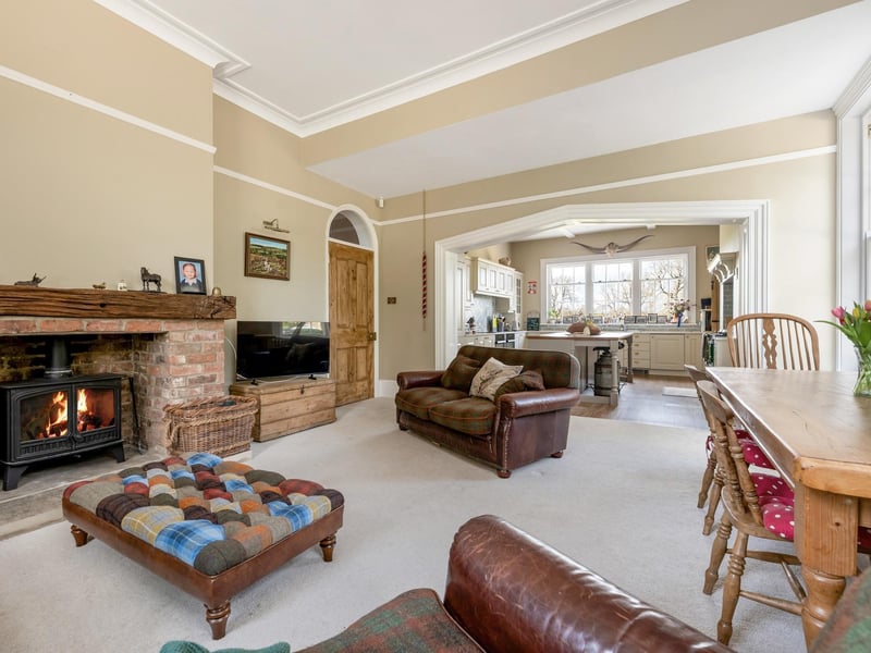 The drawing room with kitchen in the distance.