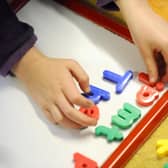 File photo dated 08/02/12 of a primary school child at work in a classroom, as almost half of children awaiting an autism assessment have been doing so for more than a year, with hundreds more waiting upwards of four years, figures show.