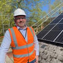 Coun Richard Wright with the new solar panels now installed on NKDC offices.