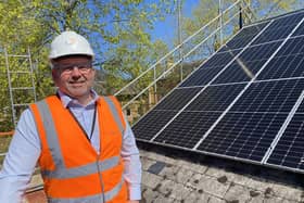 Coun Richard Wright with the new solar panels now installed on NKDC offices.
