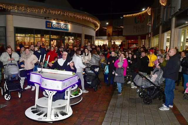 A piano playing 'nun' entertains crowds at the Pescod Square lights switch-on in Boston.