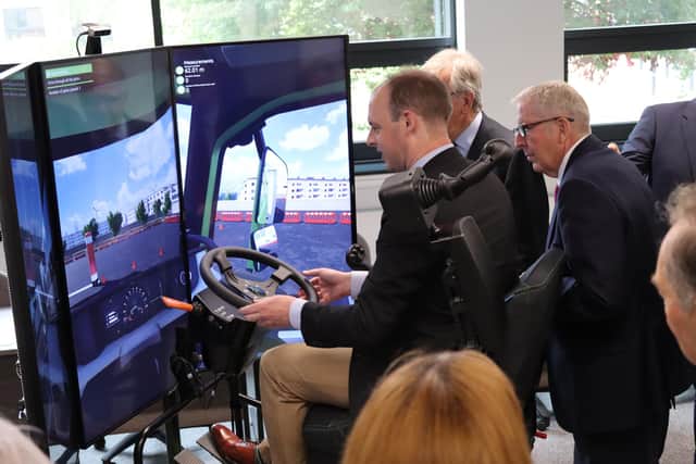 MP Matt Warman tries out the driving simulator at the new training centre.