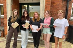 QEGS students with their results, form left: Freya Burgess, Miya Newton, Hope McIlwrick, Gabriella De Cruz, and Lola Poppy.