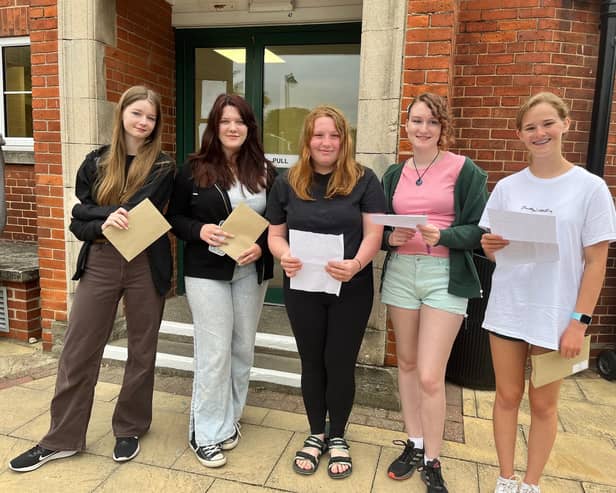 QEGS students with their results, form left: Freya Burgess, Miya Newton, Hope McIlwrick, Gabriella De Cruz, and Lola Poppy.