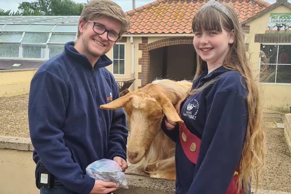 Summer Willetts presenting a cheque to Skegness Natureland Seal Sanctuary's Matt Yeadon.