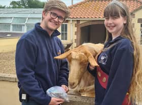 Summer Willetts presenting a cheque to Skegness Natureland Seal Sanctuary's Matt Yeadon.