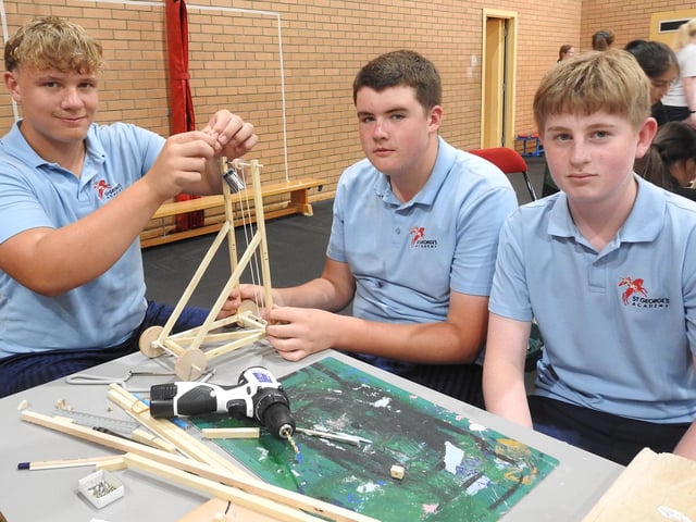 Under construction - from left - St George's Academy Year 10 students Seth Hopcroft, George Robinson and Harry Hastie. Photo: AH