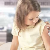 Young children getting vaccinated.