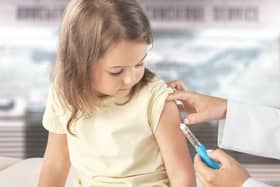 Young children getting vaccinated.