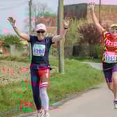 Leaping ladies - two lively participants of the Boston Marathon event. Photo: David Dales.