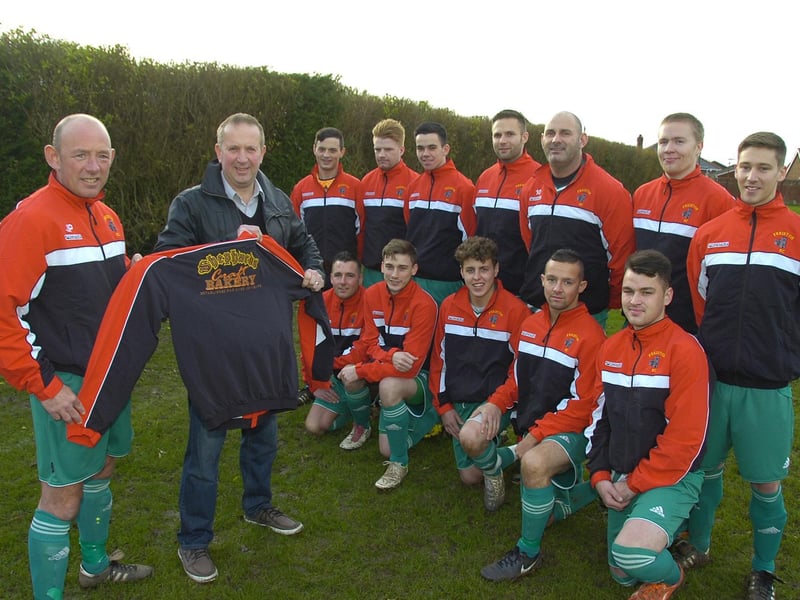 Freiston Reserves, showing off their new training tops. Captain JP Hardy is pictured in the foreground with Paul Gross, of sponsors Shephards Bakery.