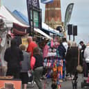 Customers browing the continental market stalls in Lumley Road, Skegness.