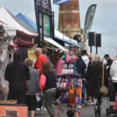 Customers browing the continental market stalls in Lumley Road, Skegness.