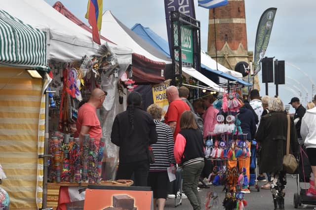 Customers browing the continental market stalls in Lumley Road, Skegness.